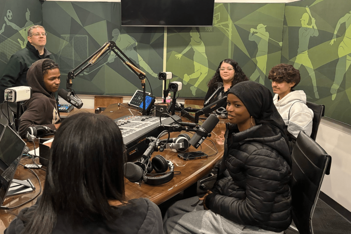 Students in a recording studio.