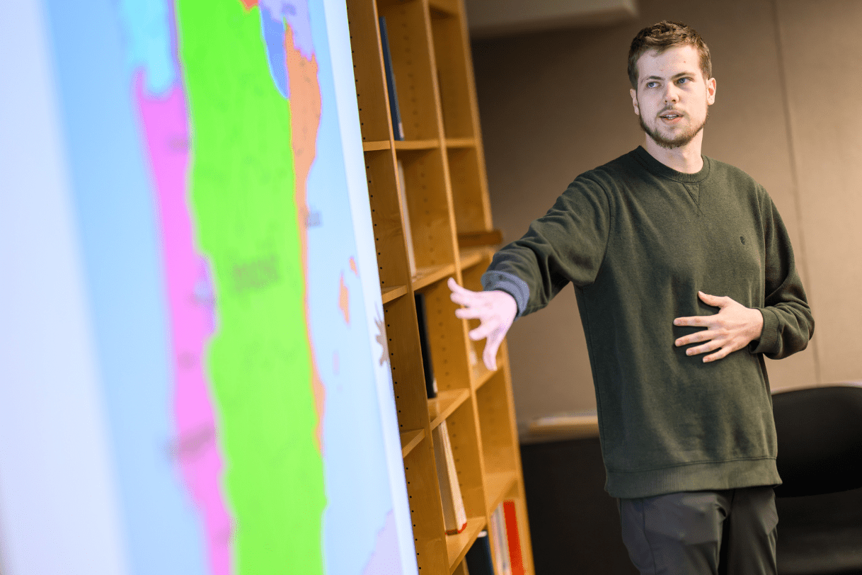 Madison student presenting their research during JMC's annual Research Showcase.