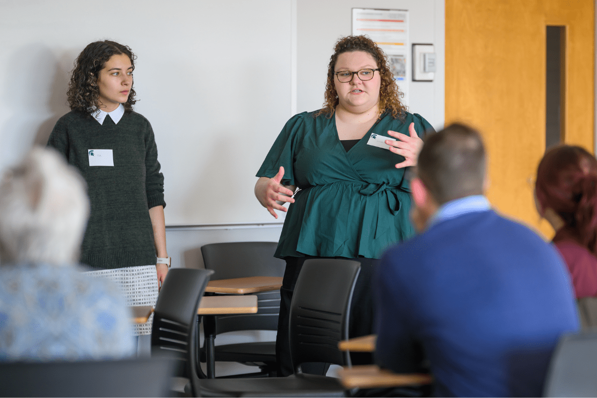 Two Madison students presenting their research during JMC's annual Research Showcase.