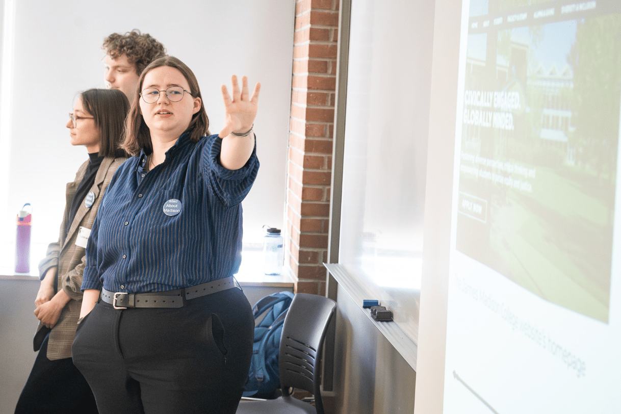 Three Madison students presenting their research during JMC's annual Research Showcase.