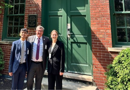 JMC students Anish Danappanavar (left) and Grace Fitzgerald (right) with Canadian Consul General Colin Bird.