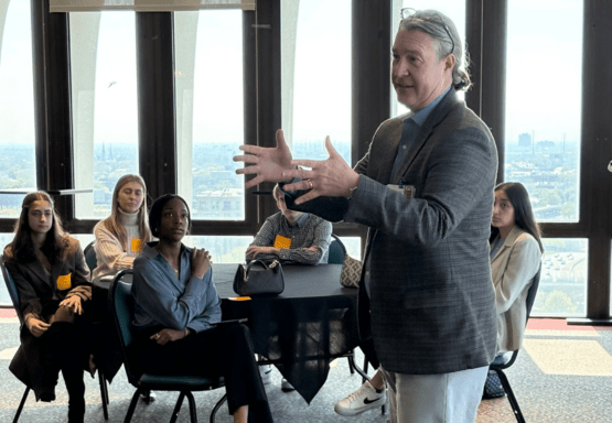 Photo of a Madison alumnus speaking to JMC students during the college's May 2025 Career Exposure Trip to Chicago.