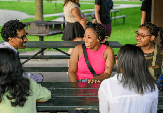 Students and Asst. Dean Brian Johnson during the Early Start picnic at Hawk Island.
