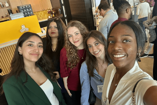 Five JMC students pose for a selfie together during the college's Career Exposure Program in May 2025.