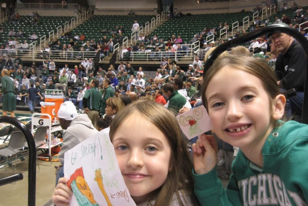Finni Padgitt and her sibling at an MSU Basketball game as young children.