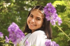 photo of Aditi surrounded by flowers