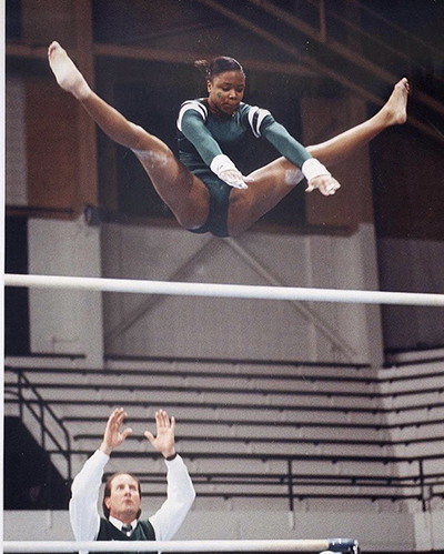 Melissa Green on the uneven bars.
