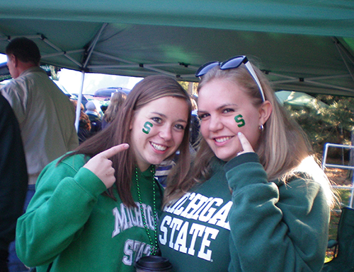 Molly  and a friend at a tailgate during her undergraduate years.