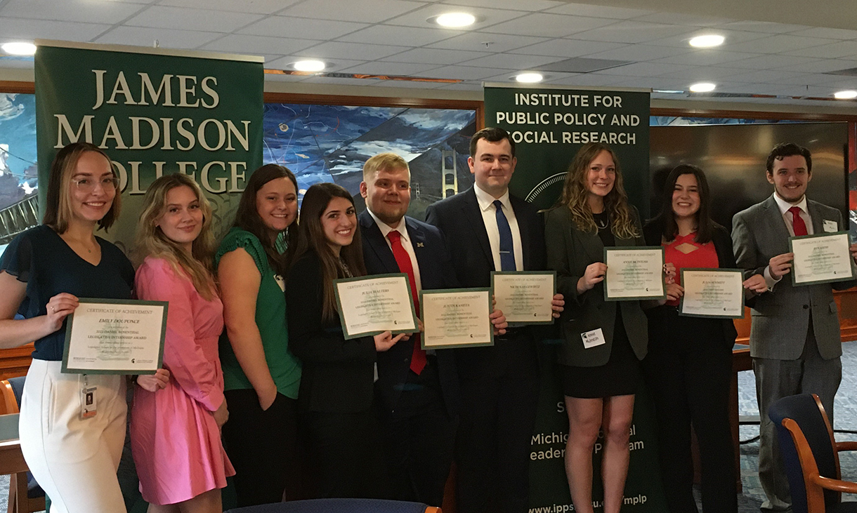 photo of several students holding award certificates