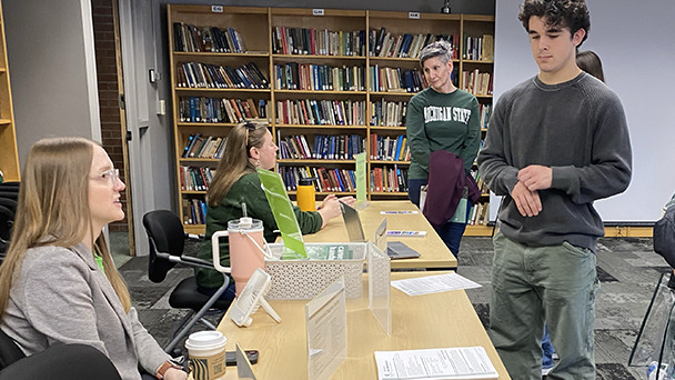 student and family speak to an adviser