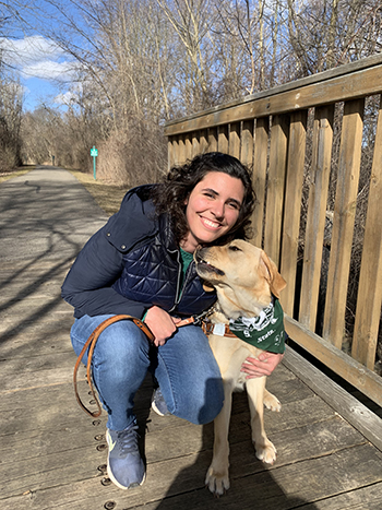 Alexandra crouched beside Leo on a bridge