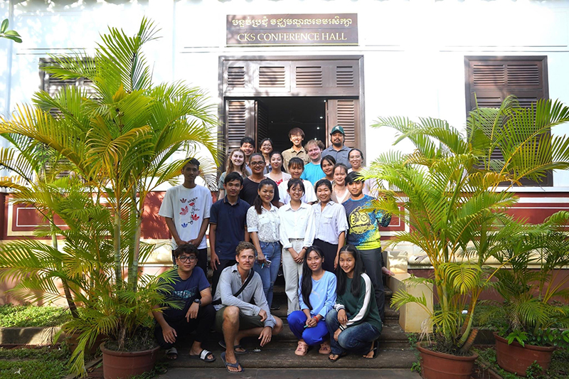 group of people standing outside of a building