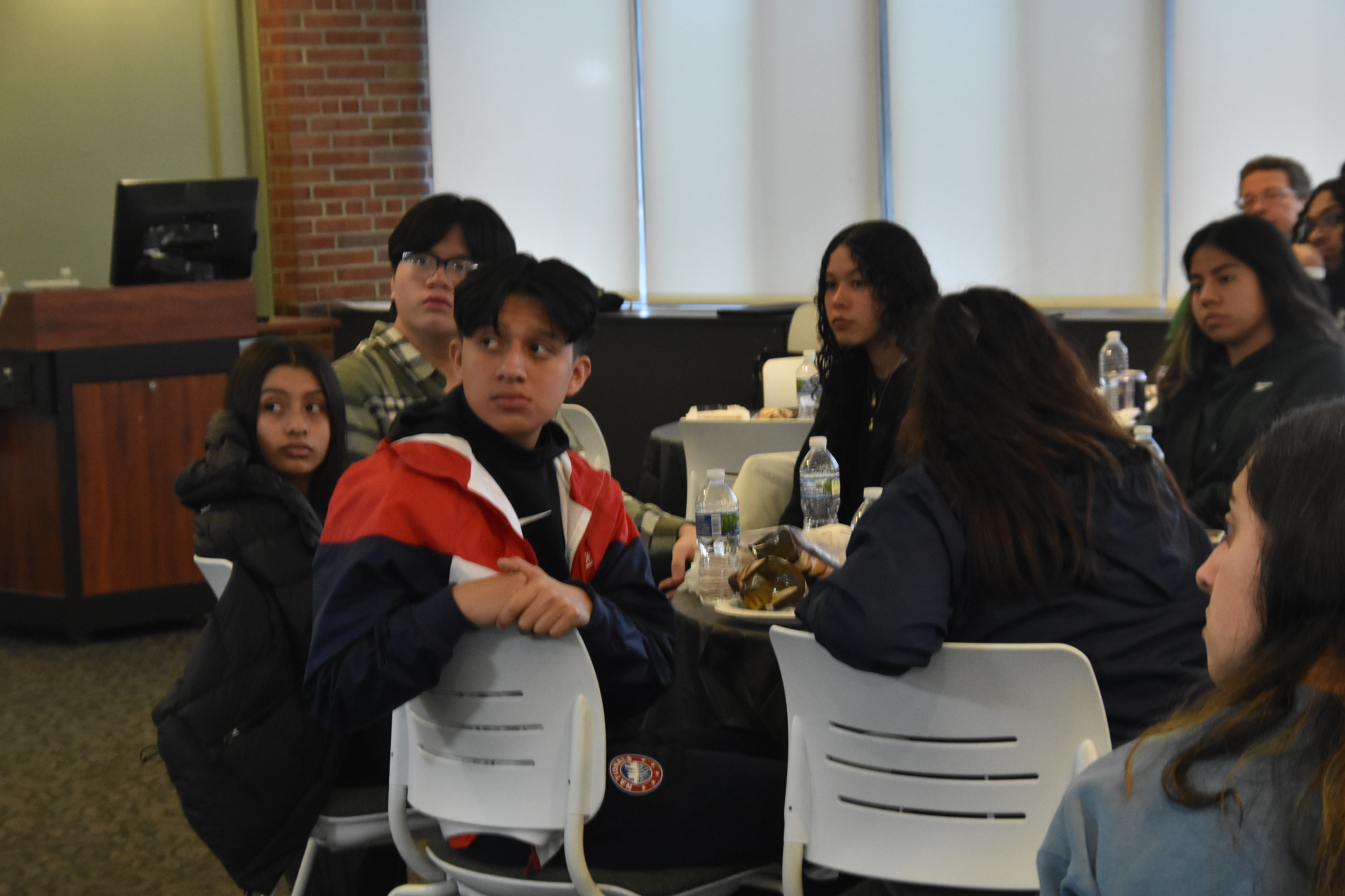Students seated at a round table