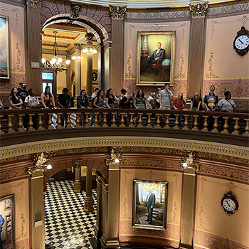 students standing in rotunda upper level
