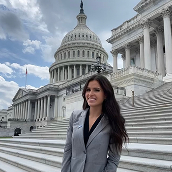 Woman standing on the steps of the U.S. Capitol in D.C.