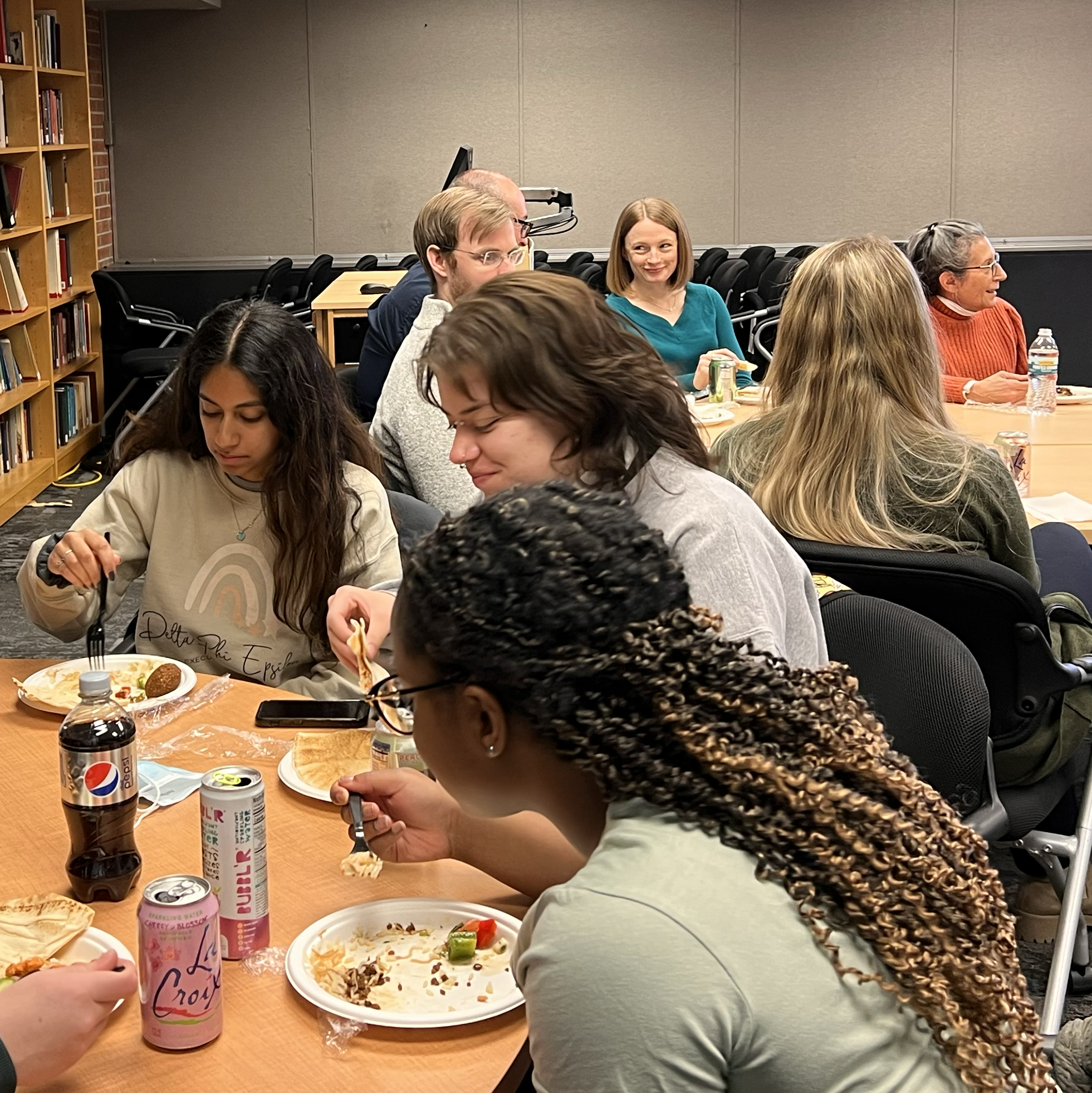 People seated together eating