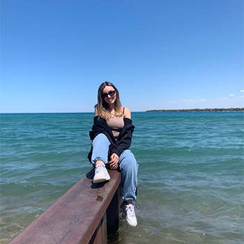 Ludovica sitting on a barge over water