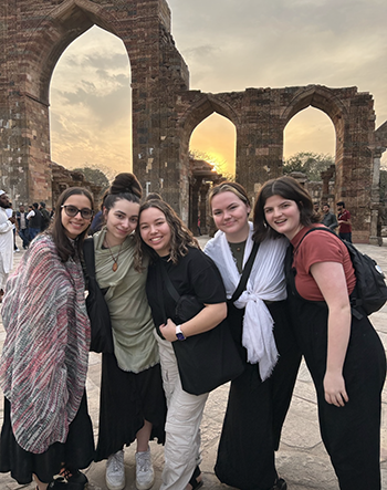 Students from the 2024 cohort of MDLP gather at Qutub Minor in Delhi