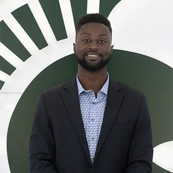 man standing in front of wall with Spartan helmet