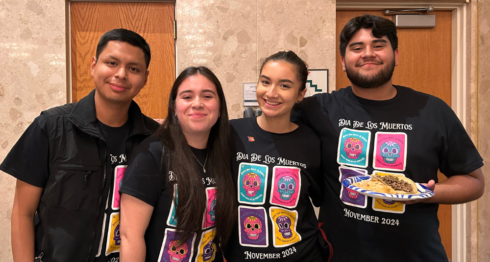 Elena Sweeney (second from right) stands with other CRU members at a November 2024  Dia De Los Muertos event on campus.