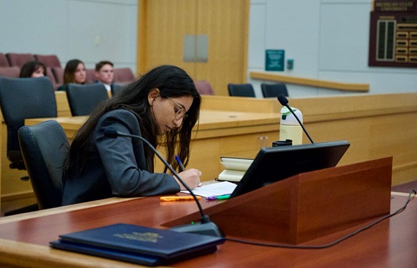 Olivia Tucker, ’25, listens to opposing counsel’s argument during a Moot Court demonstration for new students.