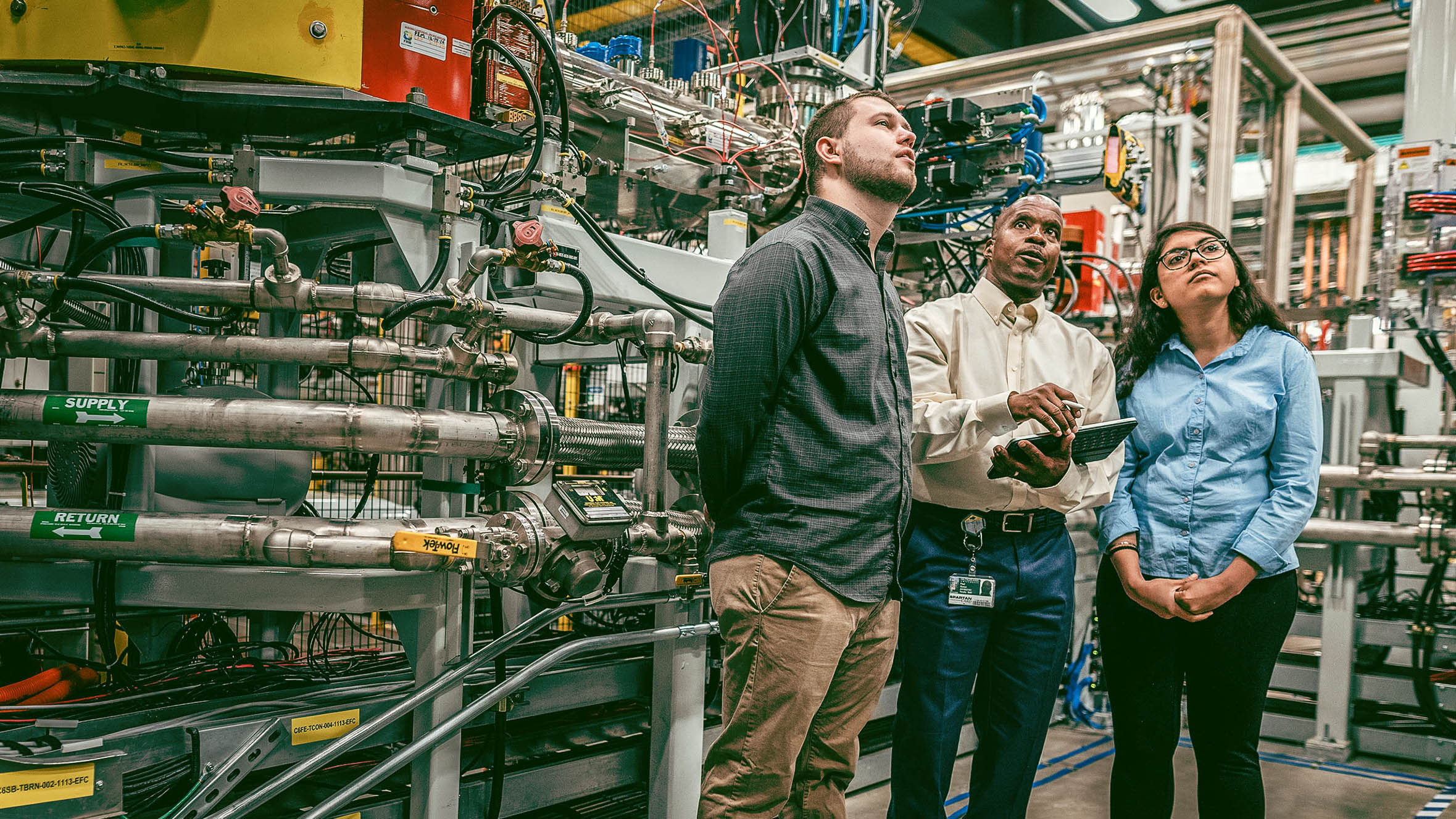 Paul Gueye and students in the FRIB facility