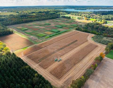 Aerial view of farmland and a small lake in the distance at the Kellogg Biological Station