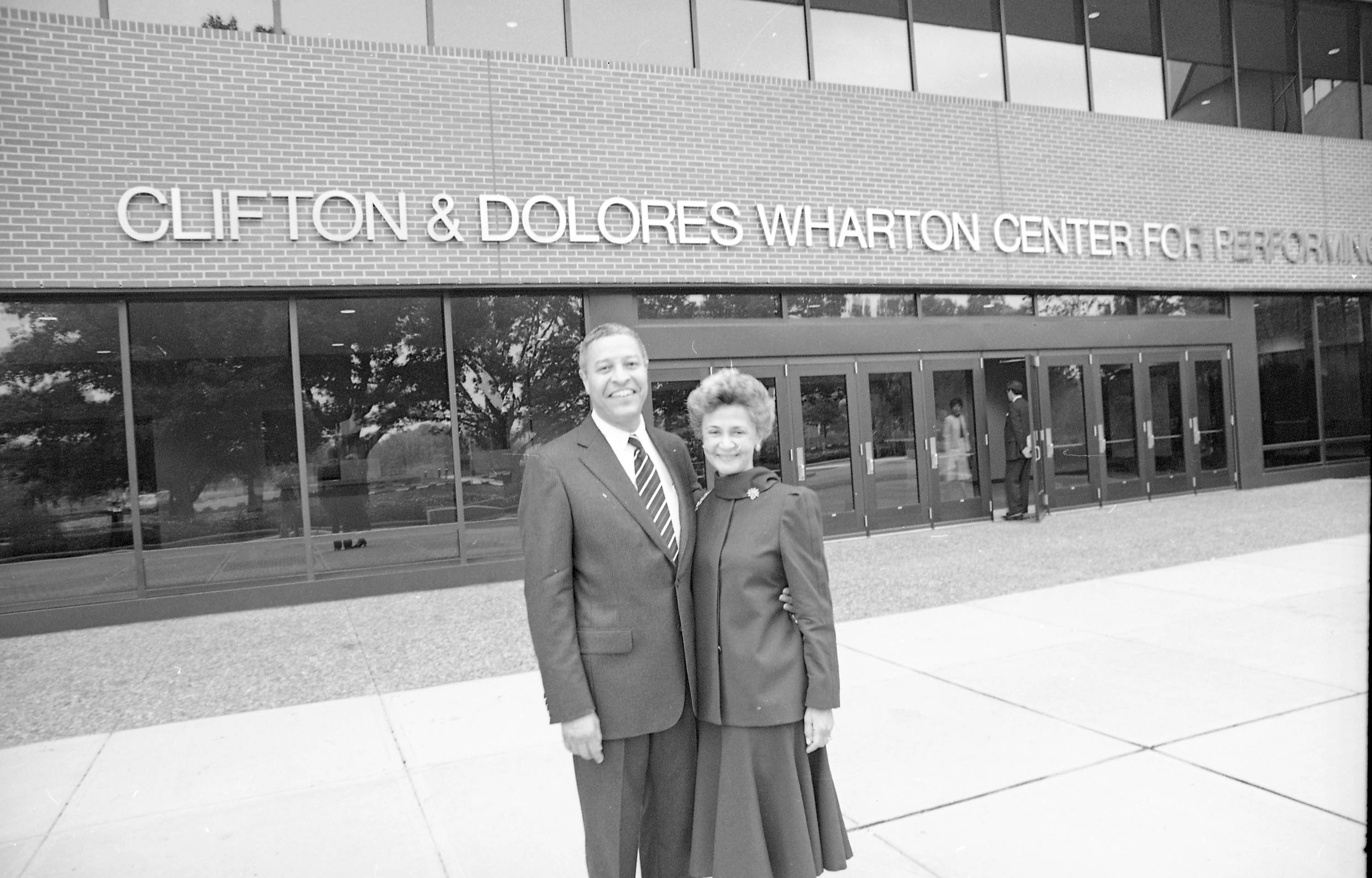 Clofton and Dolores Wharton in front of Wharton Center