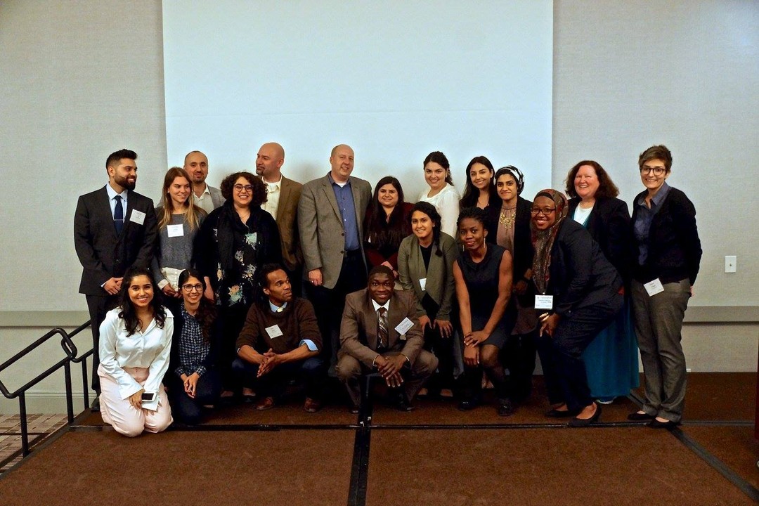 A group photo featuring the volunteers, advisors, and planning commitee for the Annual Muslim Mental Health Conference.