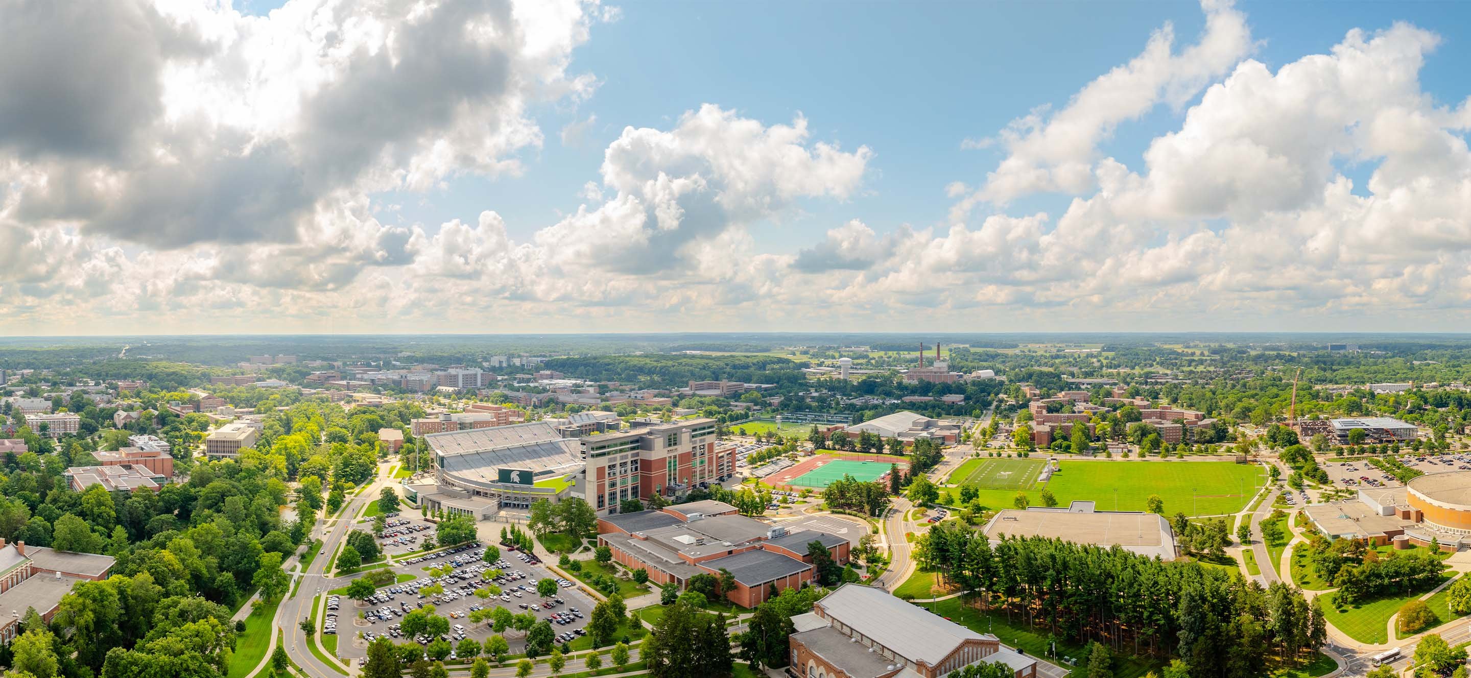 View of a large portion of MSU's campus from high, featuring Spartan Stadium and other athletic fields. 