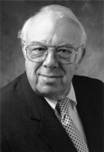 A black and white portrait of Dr. Norbert B. Enzer.
