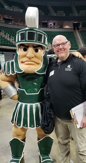 Andrew Murray poses with Sparty.