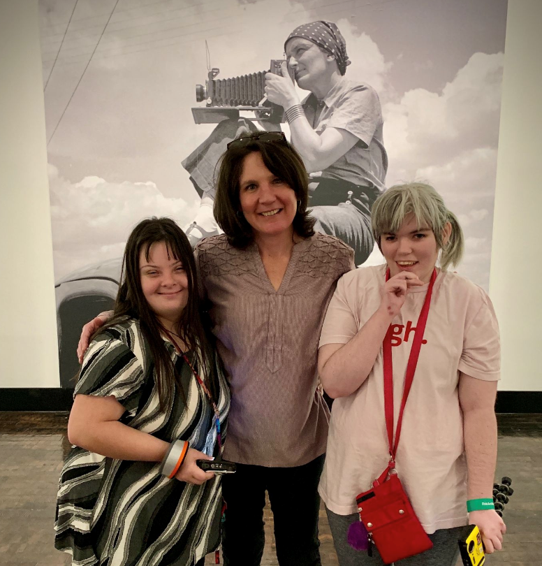 Jen Vogus, '96, with two members of AbleVoices photography program.