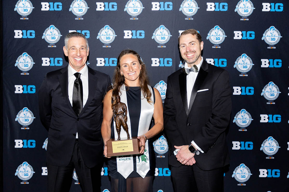 MSU Field Hockey graduate Maddie Lawlor stands holding the 2026 Big Ten Jackie Robinson Community & Impact Award.