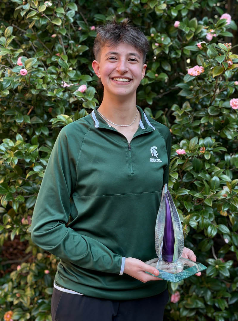 MSU Debate team member Joanna Gusis with award.