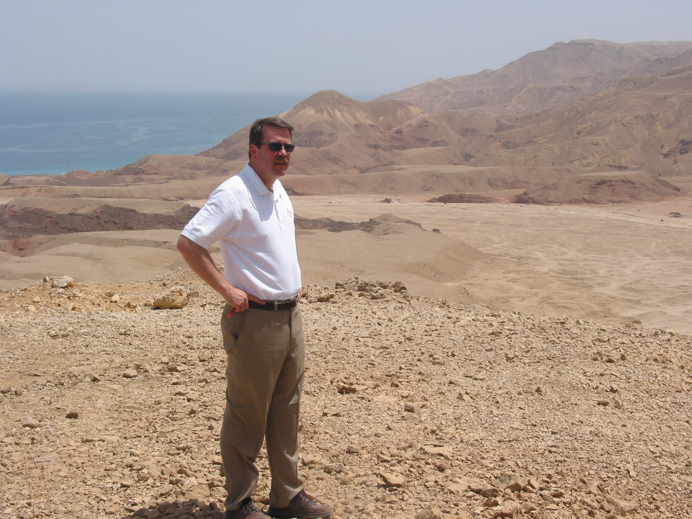 Ray Hearn earlier in his career looking at a potential project site overlooking the Red Sea in Egypt. Photo Credit: Raymond Hearn GC Designs 