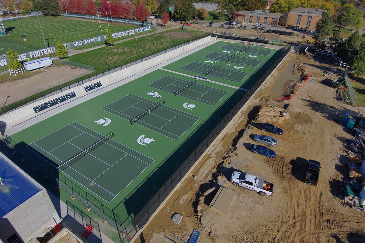 Drone photo of the new men's and women's tennis courts in a state of near-completion.