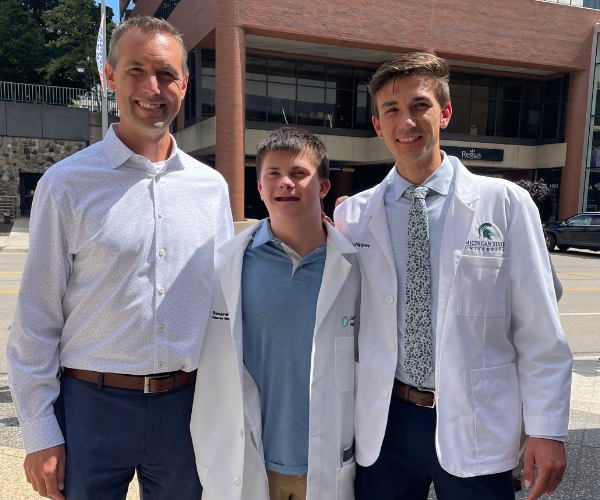 Luke Schipper with his father and brother Drew