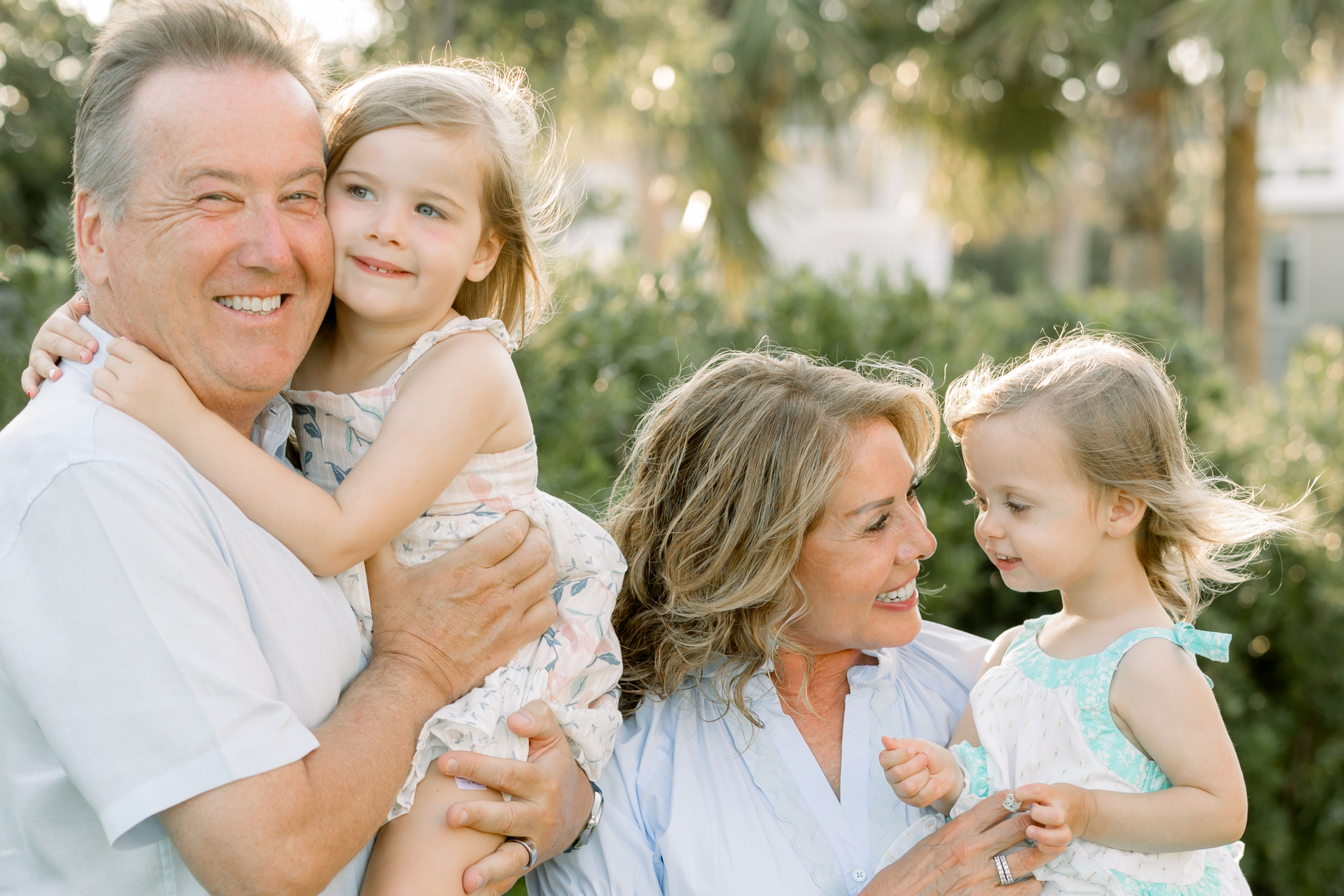 michael and mary lamach and two family members pose outdoors in the sunshine