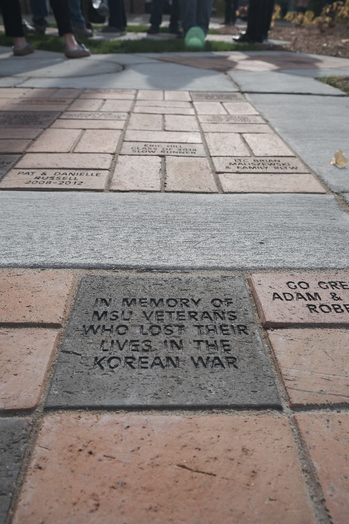 Commemorative brick placed in the walkway of IM Demonstration Hall Plaza to honor Korean War veterans.