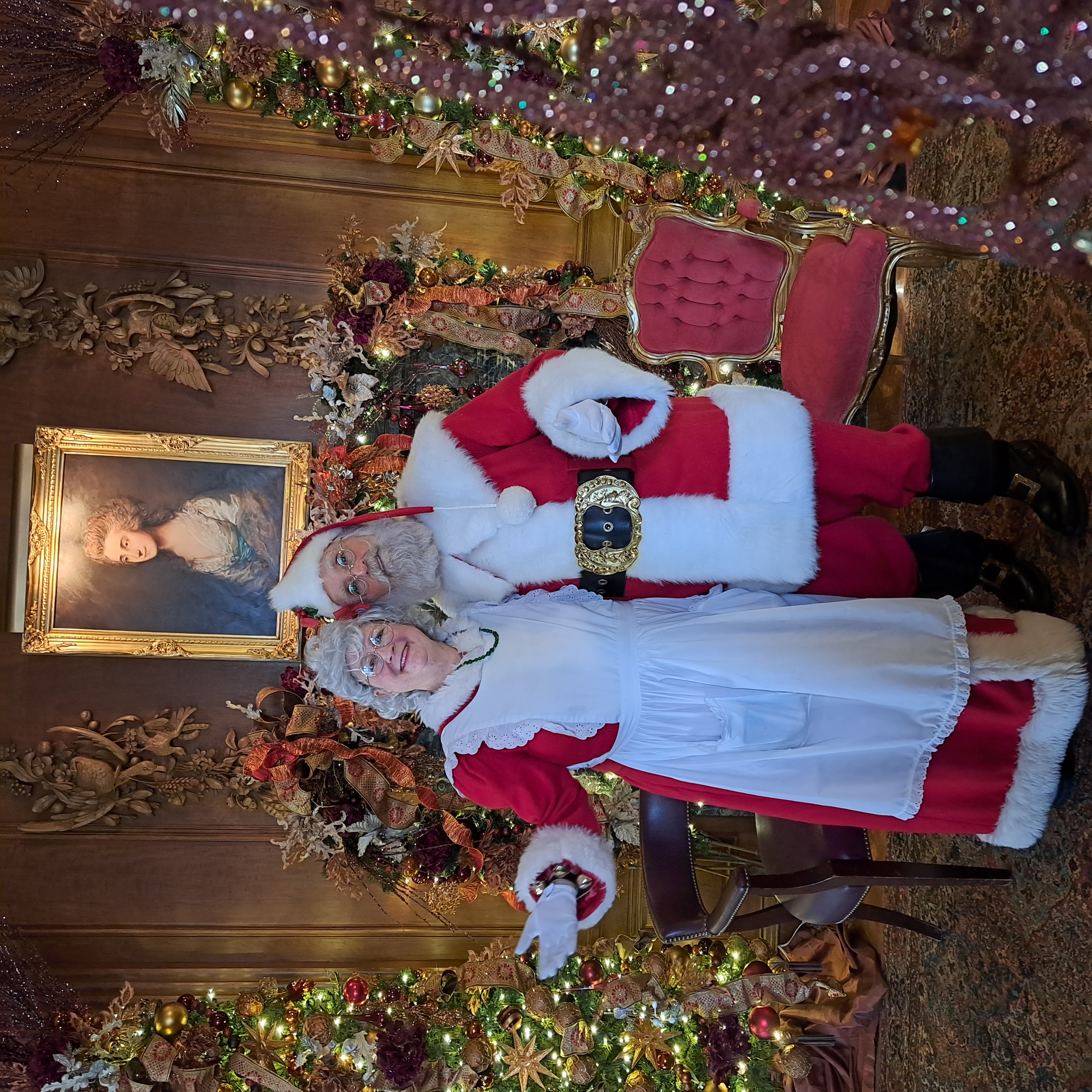 Lisa Heileman, '86, left, as Mrs. Claus with Santa Claus at Meadow Brook Hall in 2023.