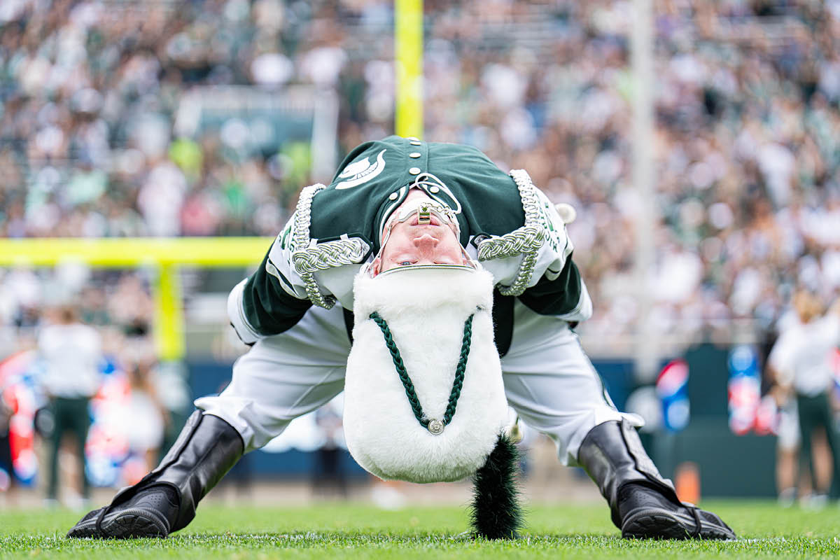 Michigan State Drum Major Tom McGovern performs a back bend.
