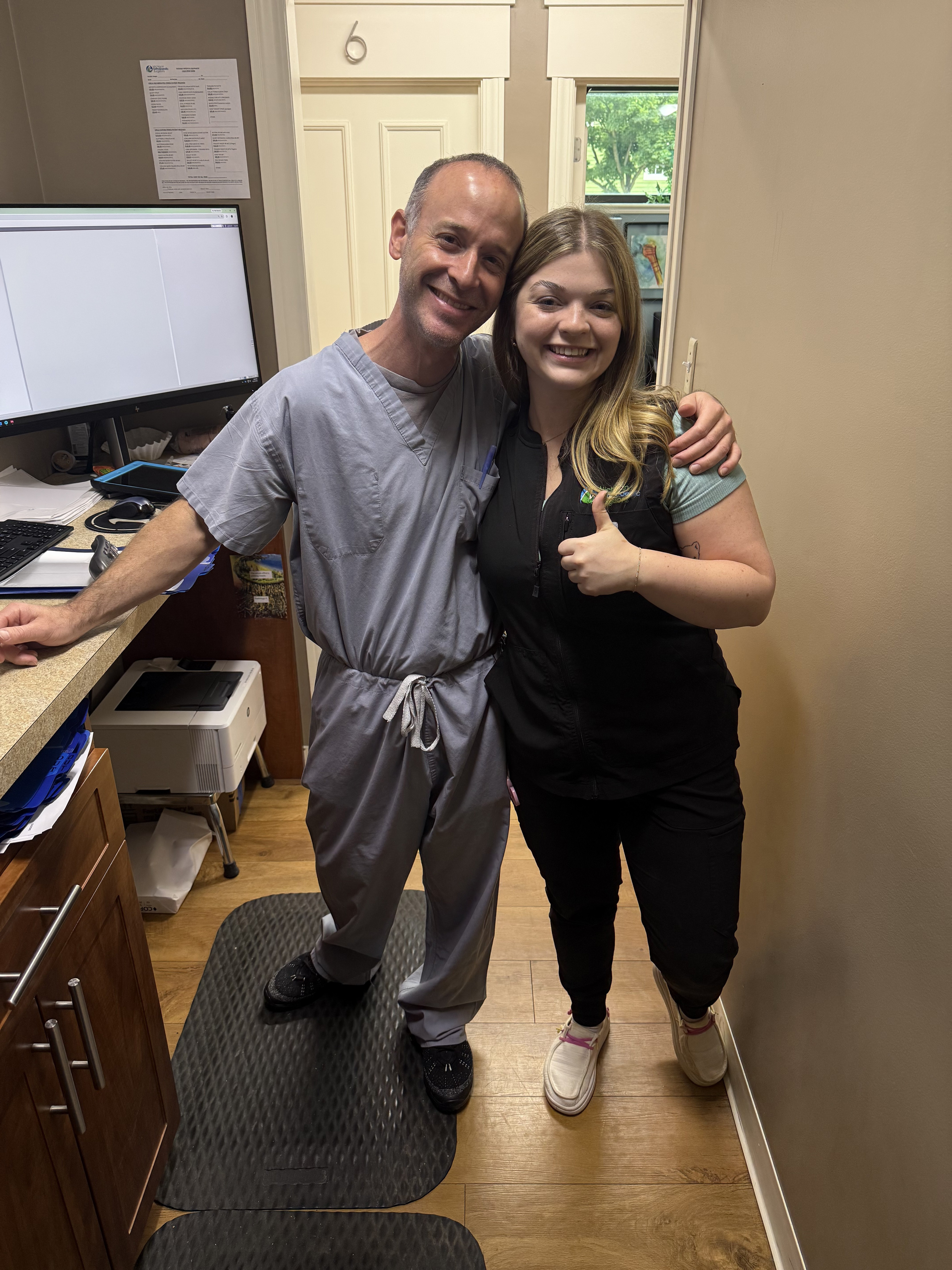 Bella Hilden with a colleague at work as a medical assistant.