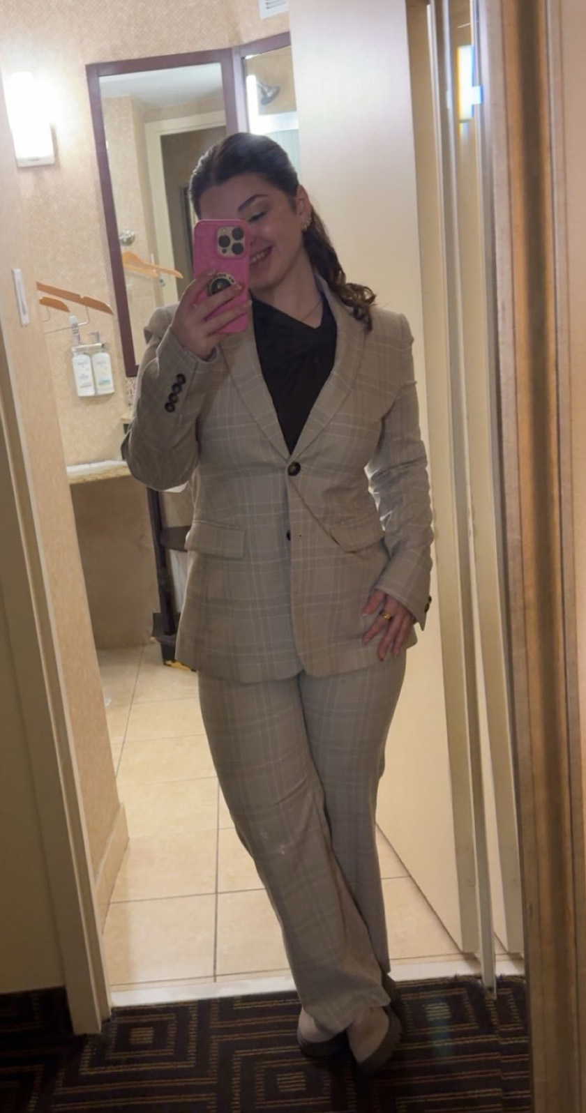 Bella Hilden in professional attire taking a selfie before a PA school interview.