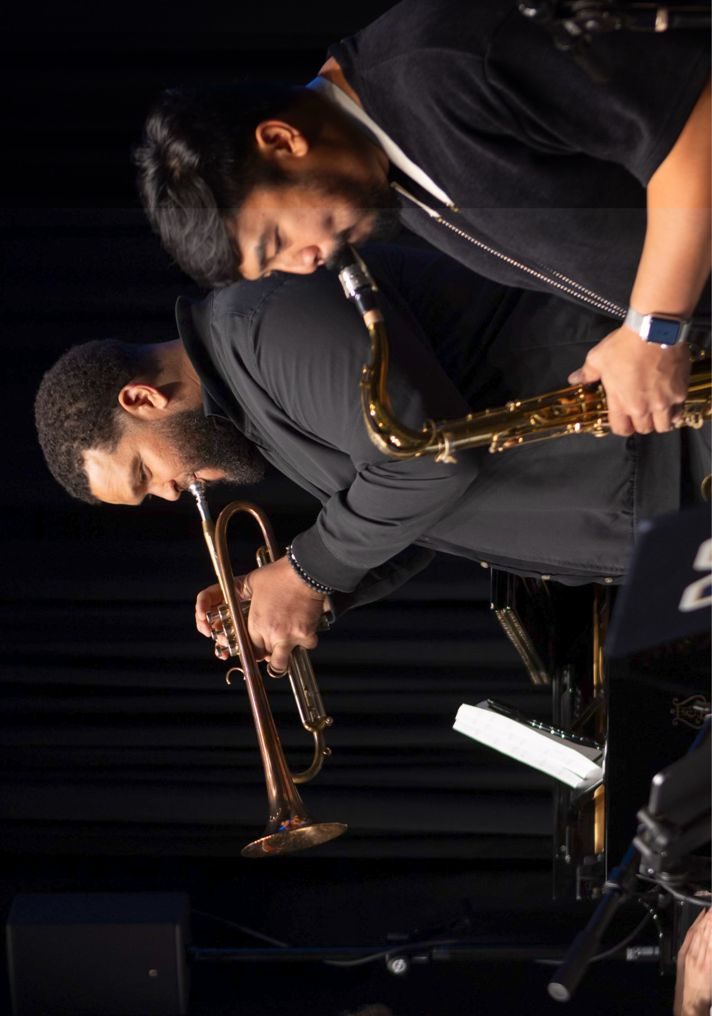 Kris Johnson playing a trumpet on stage