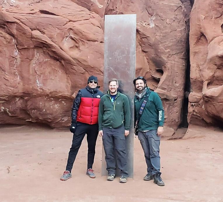 spartans in front of monolith