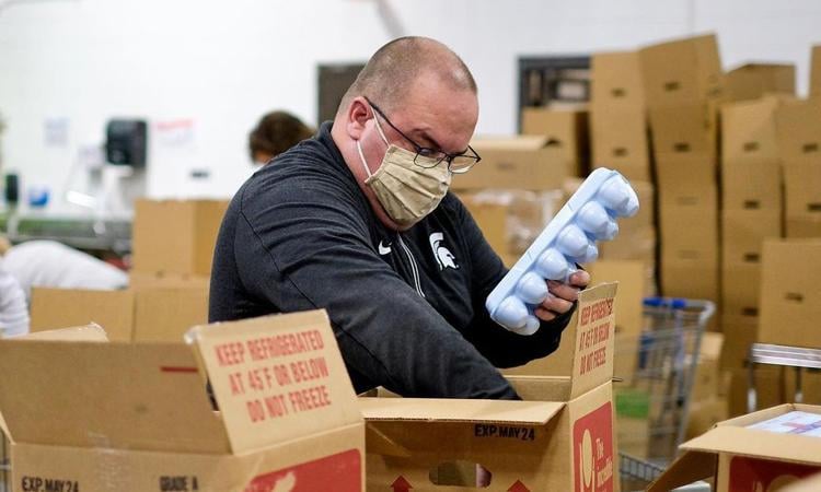 Calhoun Spartan packing eggs in a box