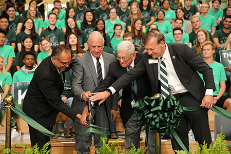 dean gupta, edward minskoff, eli broad, and president stanley at a ribbon cutting