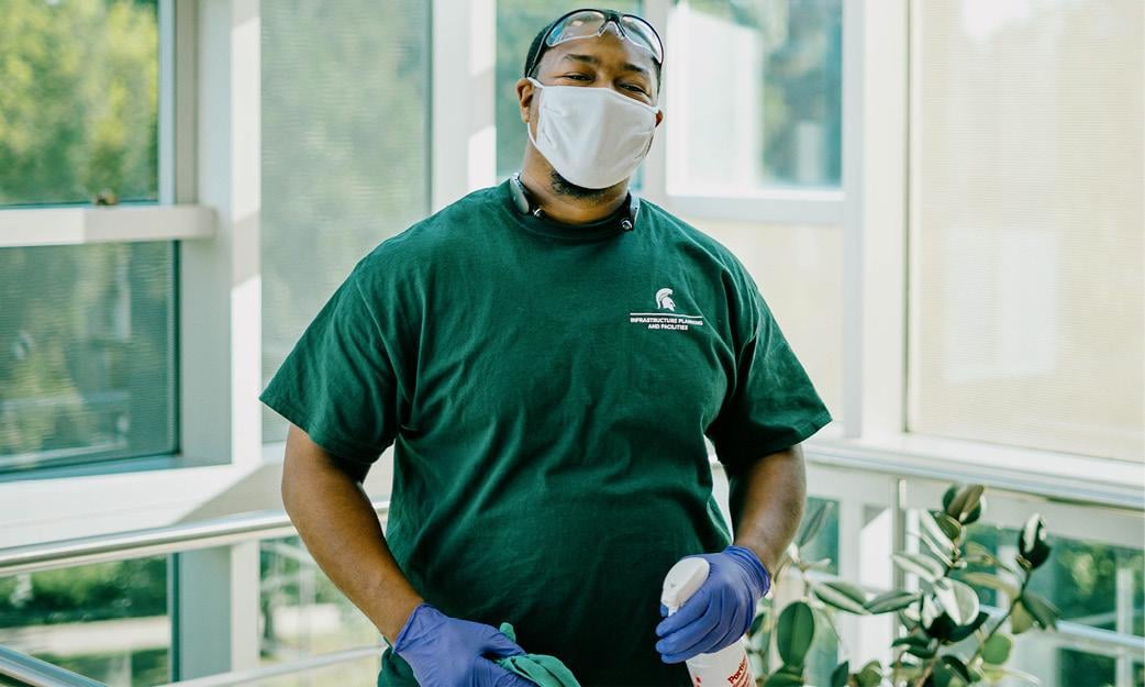 IPF worker preps to disinfect surfaces on campus. 