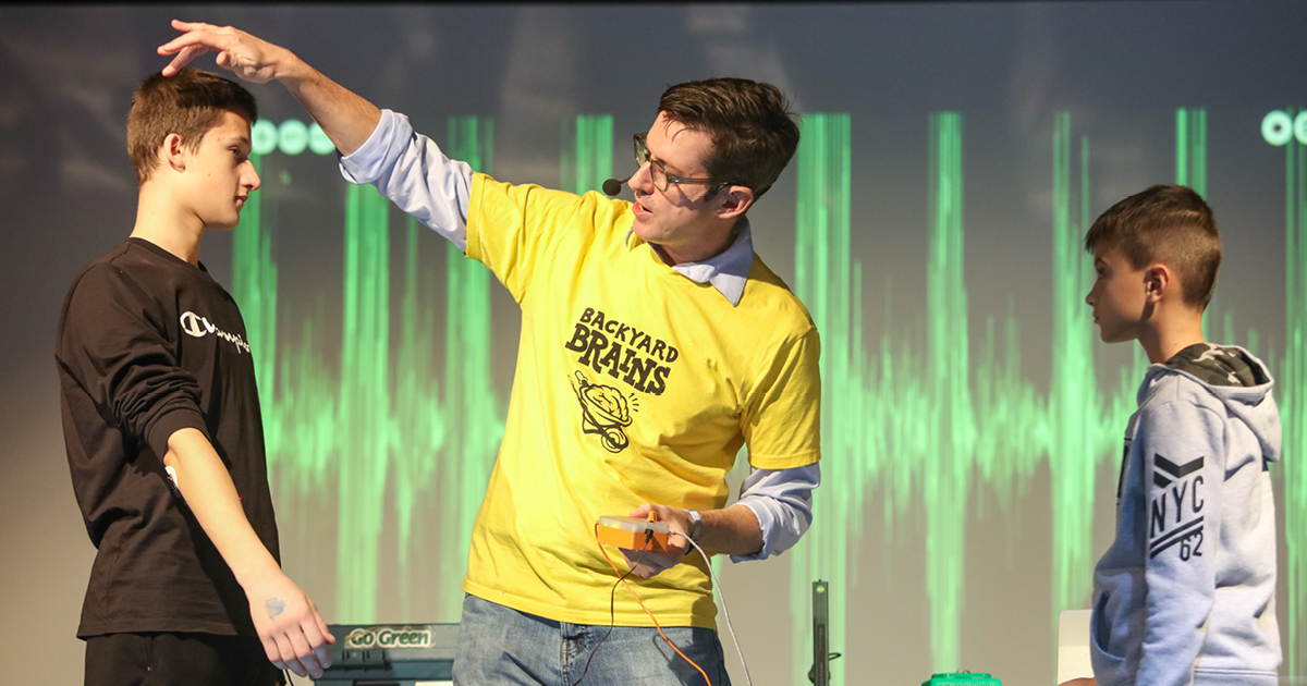 Gage delivering a speech to schookids